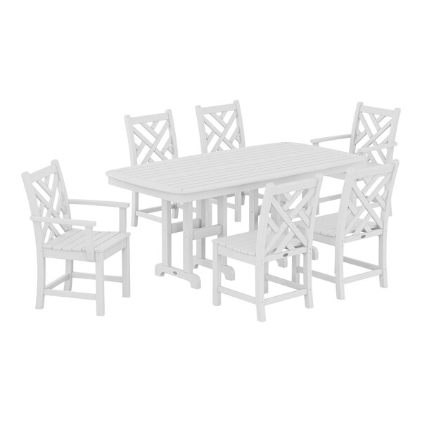 A white POLYWOOD Chippendale table and chairs set.