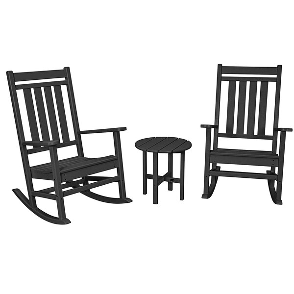 A black POLYWOOD rocking chair with armrests and a round table.