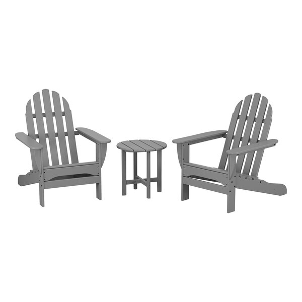 Three POLYWOOD classic slate grey Adirondack chairs and round side table.