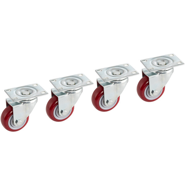 A row of Lancaster Table & Seating swivel casters with red wheels.