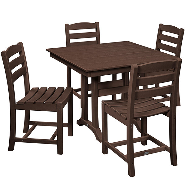 A POLYWOOD mahogany dining set with four chairs on a trestle table outside.