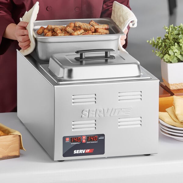 A woman using a ServIt electric countertop food cooker to serve food.