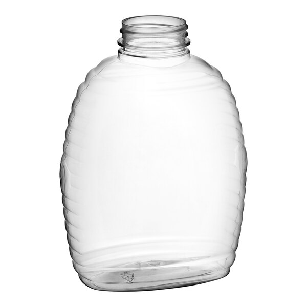 A clear plastic Queenline honey bottle with a lid.