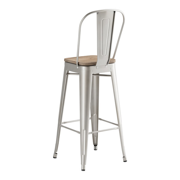 A Lancaster Table & Seating silver metal barstool with a gray wood seat.
