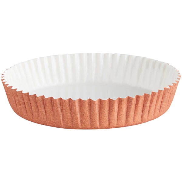 A Novacart Terra Cotta paper baking mold with a white rim.