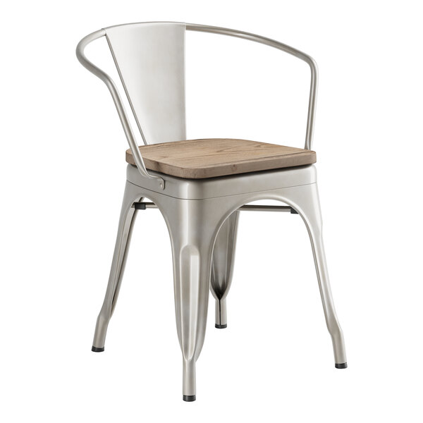 A Lancaster Table & Seating metal arm chair with a gray wood seat.