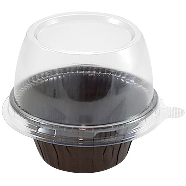 A clear plastic dome lid on a brown Novacart baking mold.