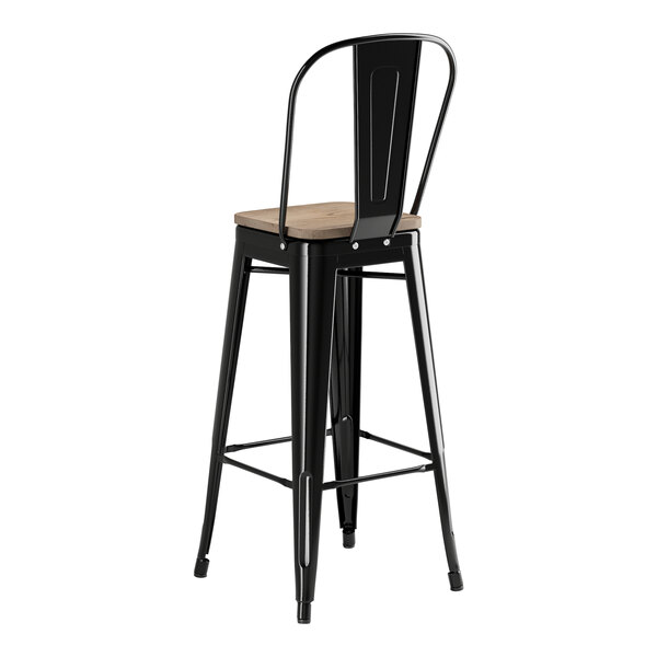A Lancaster Table & Seating black metal bar stool with a gray wood seat.