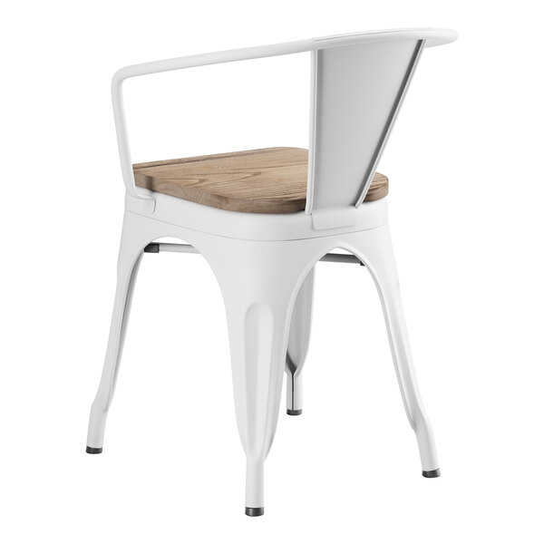 A white Lancaster Table & Seating metal arm chair with a gray wood seat.