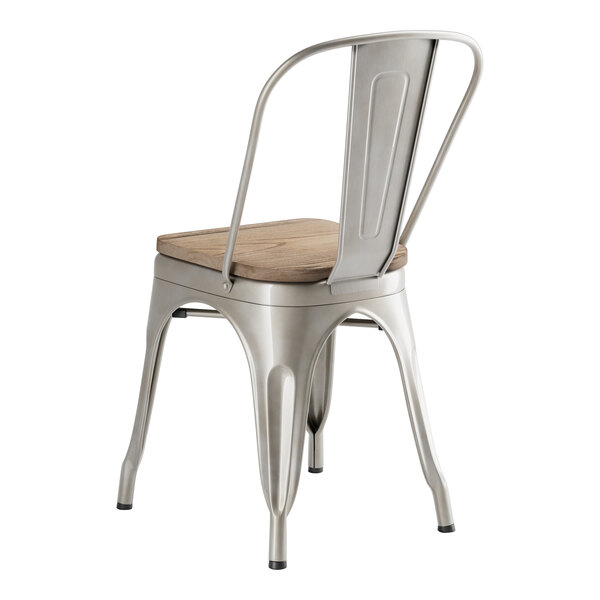 A Lancaster Table & Seating metal cafe chair with a gray wood seat.