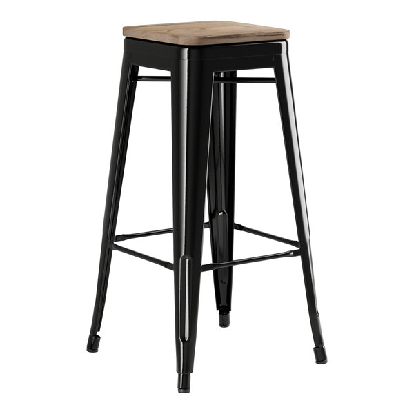 A Lancaster Table & Seating black metal bar stool with a gray wood seat.