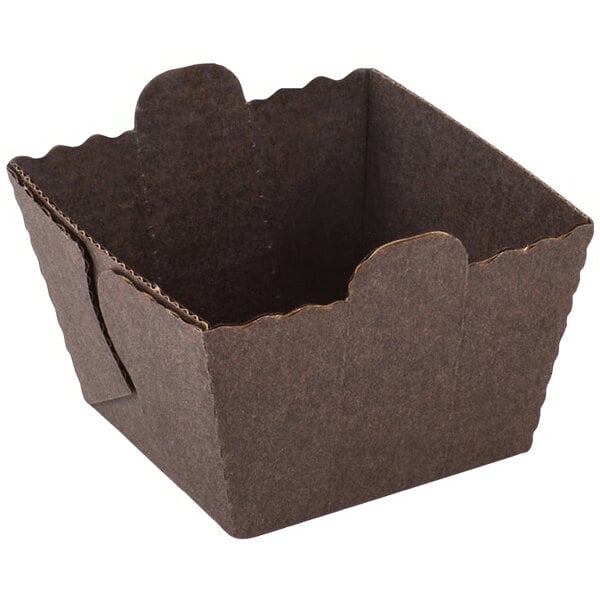 A brown cardboard box with a scalloped edge.