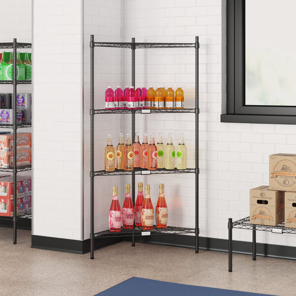 A black metal Regency wire shelf with bottles and boxes of drinks.