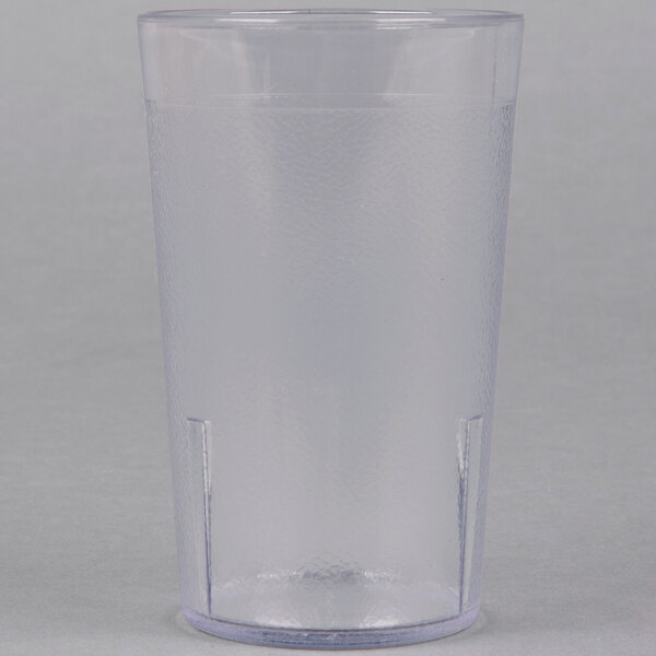 A clear plastic cup with a blue lid.