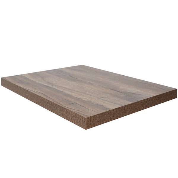 A BFM Seating knotty pine rectangular table top with a dark brown finish.