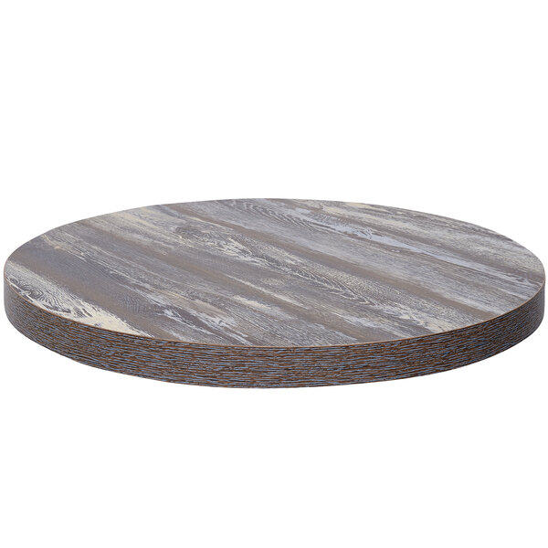 A BFM Seating Relic round wooden table top with a gray and white finish.