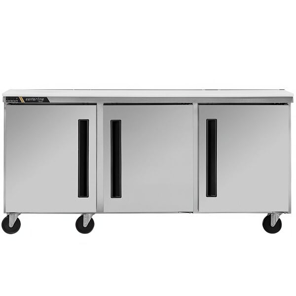 A stainless steel Traulsen undercounter refrigerator with two doors and two drawers.