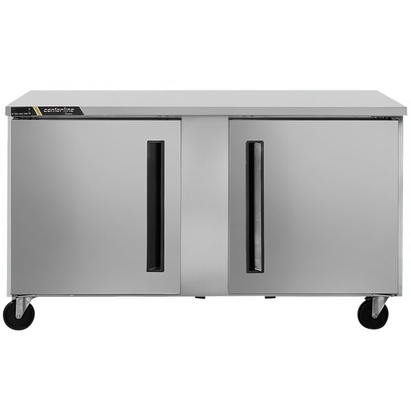 A silver Traulsen undercounter refrigerator with black handles.