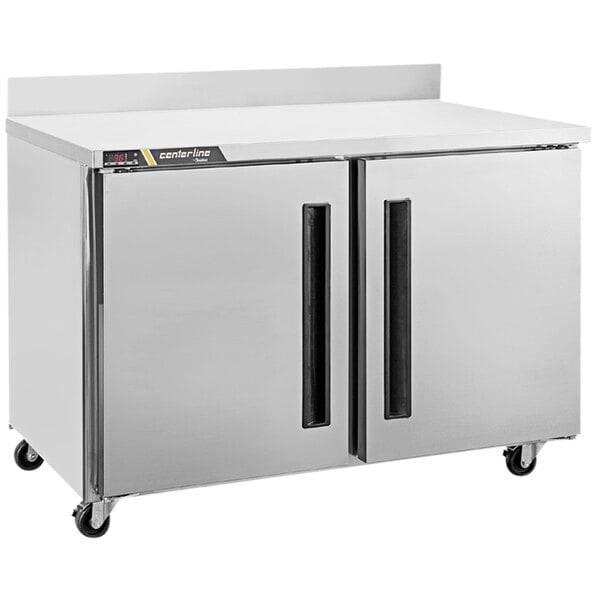 A white Traulsen compact worktop refrigerator with two left hinged doors.