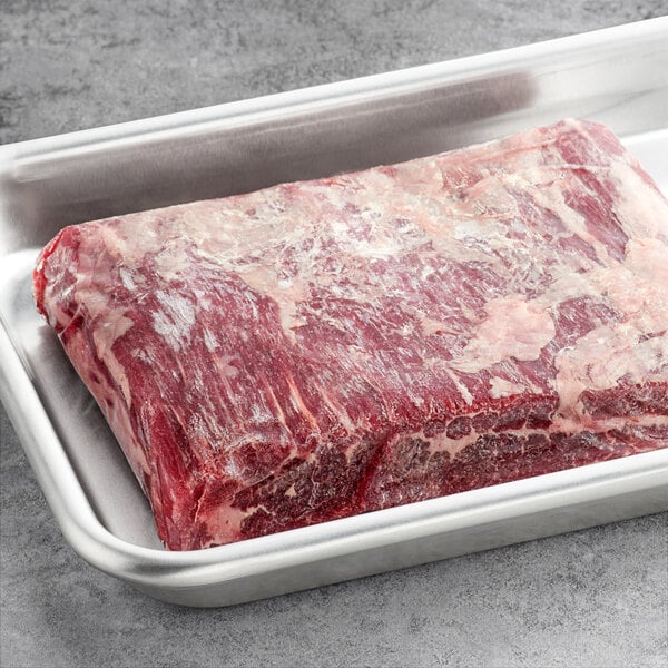 Warrington Farm Meats flank steak in a metal tray.