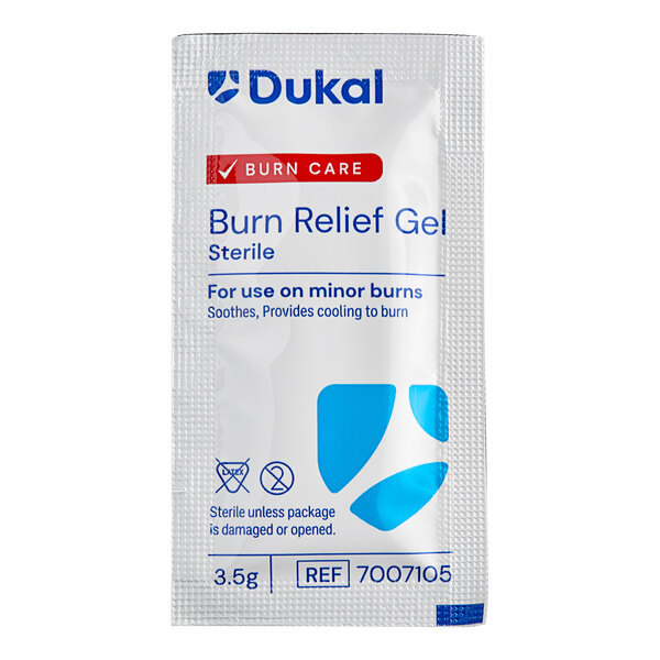 A white Medique packet with blue text for burn relief gel.