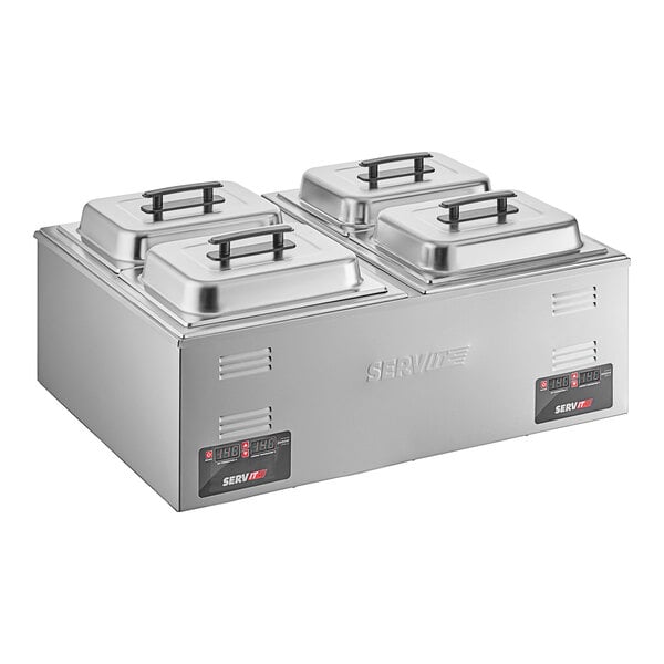 A stainless steel ServIt countertop food warmer with trays and lids.
