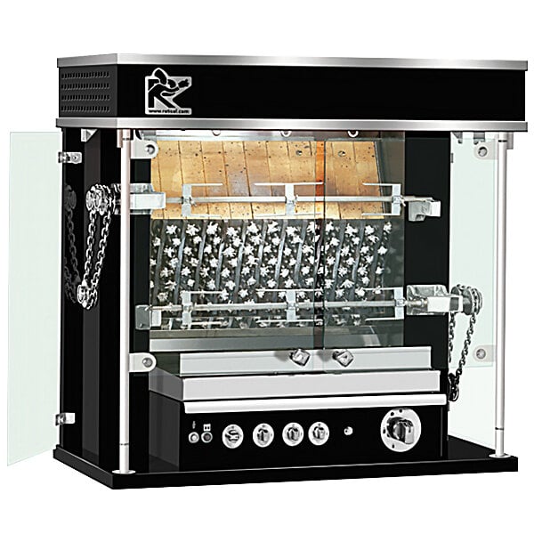 A black and silver Rotisol-France MasterFlame liquid propane rotisserie with a glass door.