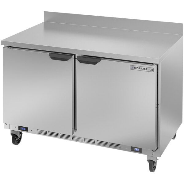 A silver Beverage-Air dual temperature worktop freezer / refrigerator with wheels.