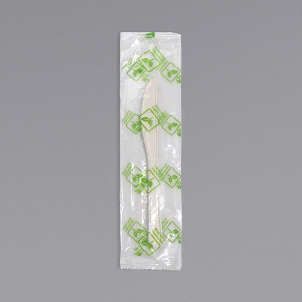 A Fineline Conserveware individually wrapped white PSM knife in a plastic bag.