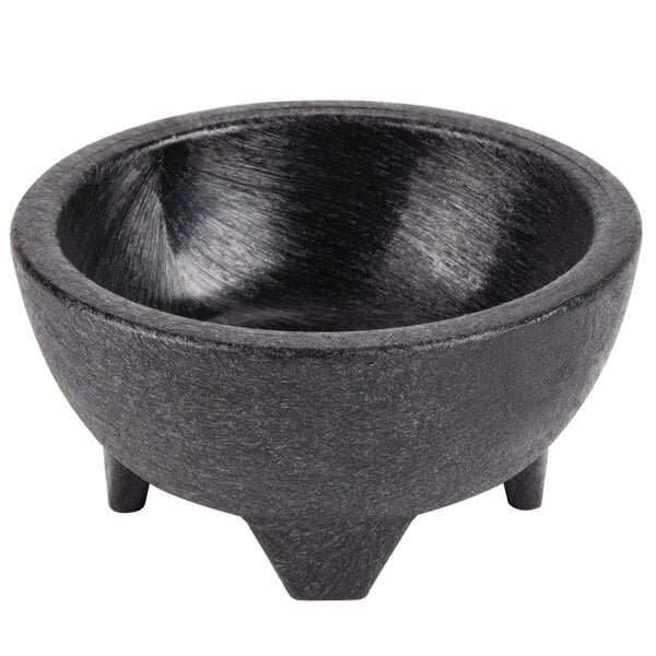 A black polypropylene molcajete bowl with three legs.
