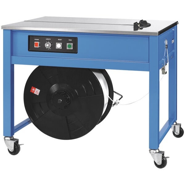 A blue and silver PAC Strapping semi-automatic table strapping machine with a black reel on it.