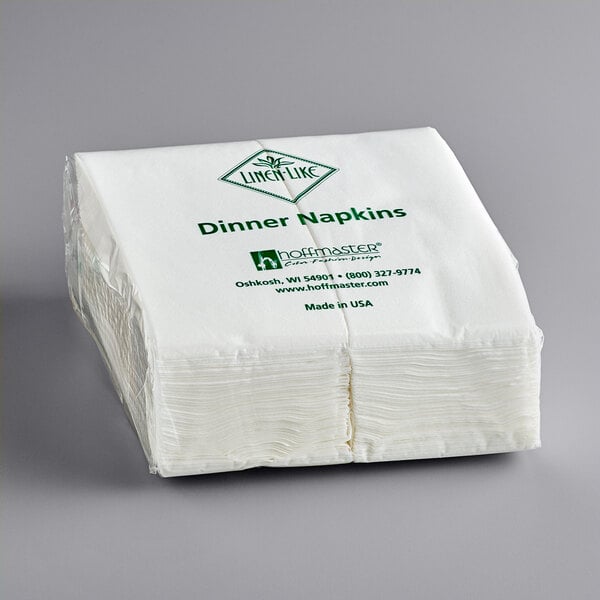 a stack of napkins on a gray surface