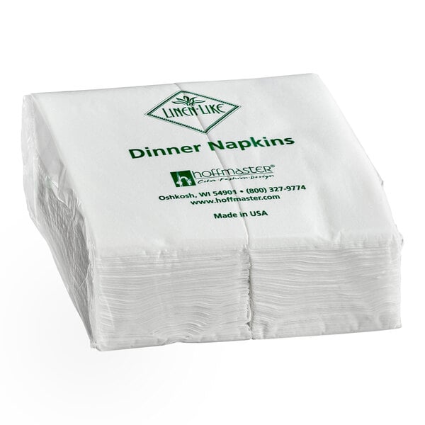 A stack of white linen-like dinner napkins, 17 by 17 inches, packaged in a case of 300.