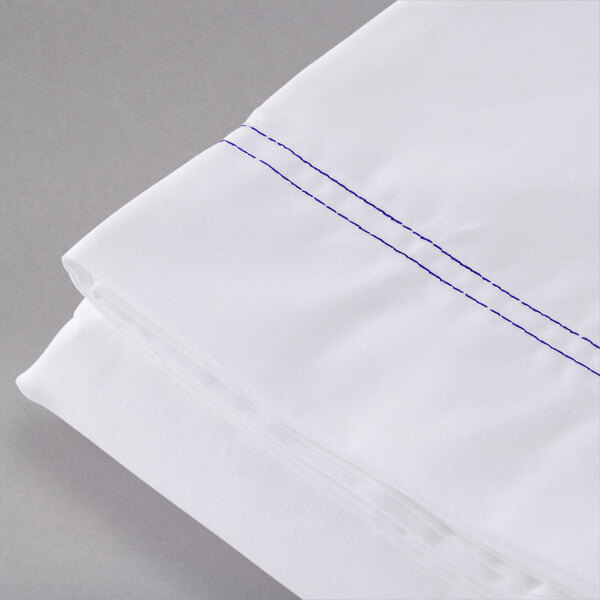 a white sheet with blue stitching