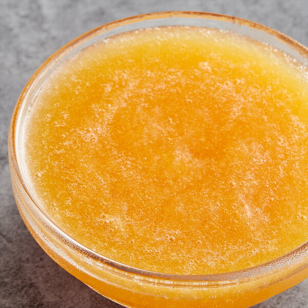 a bowl of orange liquid