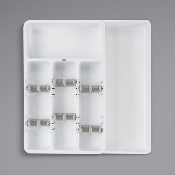 A white plastic tray with six compartments.