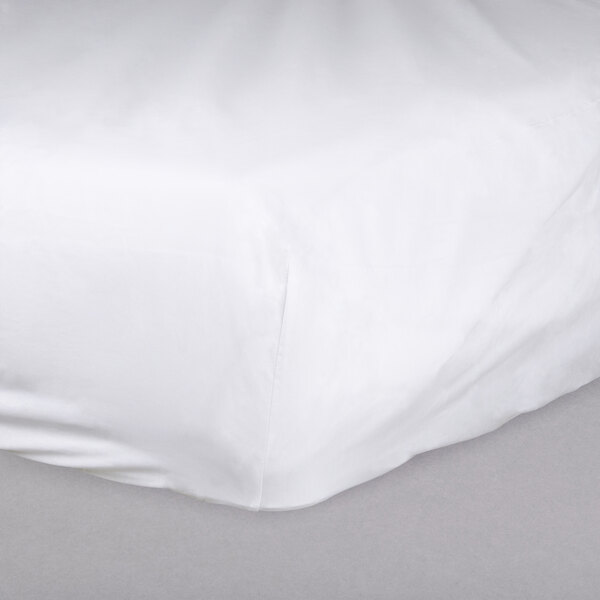 A white Oxford Superblend fitted sheet on a bed.