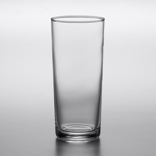 a clear glass with a black rim