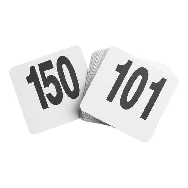 A stack of white square cards with large black numbers, showing '150' and '101' on top.