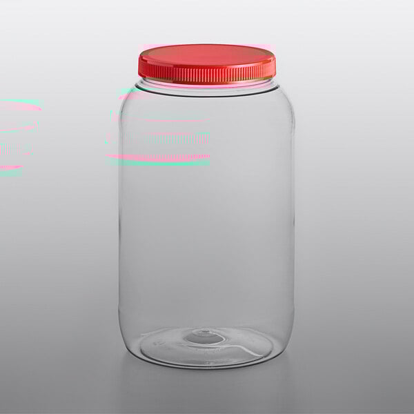 A clear plastic jar with a red lid.
