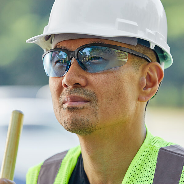 Worker wearing safety glasses and a hard hat