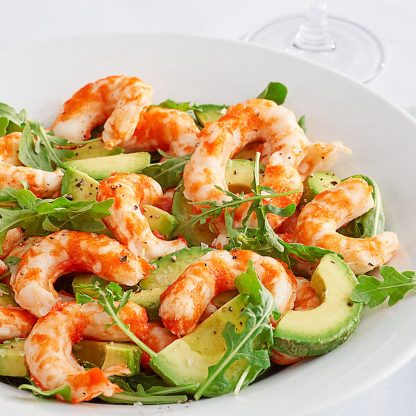 A plate of Beleaf plant-based jumbo shrimp, avocado, and greens.