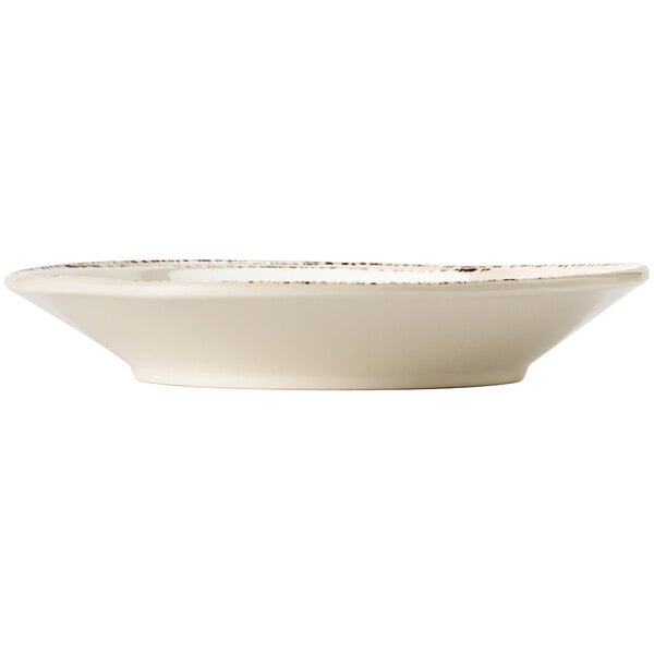 A Libbey ivory melamine bowl with a brown rim.