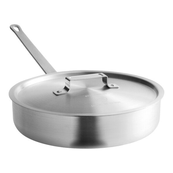 A stainless steel sauté pan with a lid, part of a 7-cup egg poacher set.