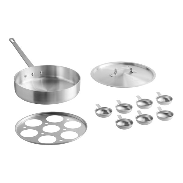 A stainless steel 7-cup egg poacher set with a sauté pan, lid, poaching insert, and seven individual egg cups.