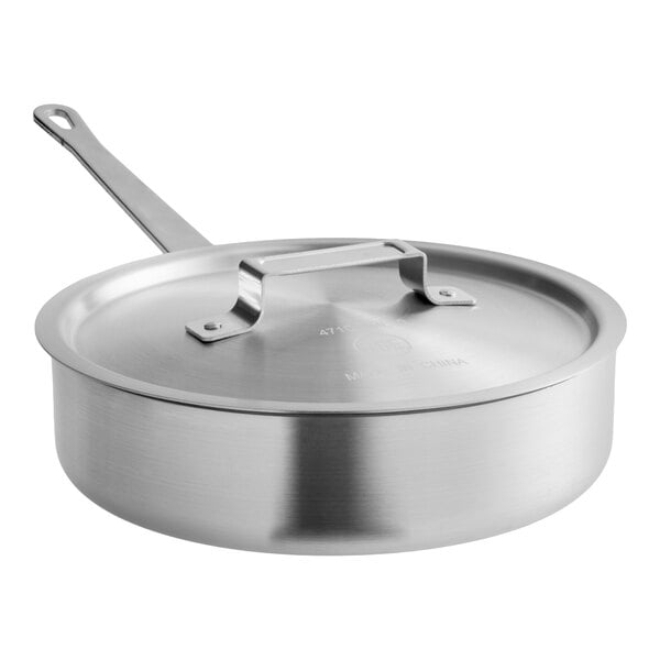 A stainless steel saute pan with a lid, part of a 5-cup egg poacher set.