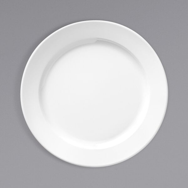 A Libbey Basics bright white melamine plate on a gray surface.