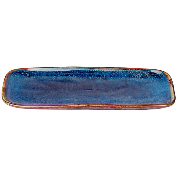 A blue rectangular porcelain platter with a red rim.