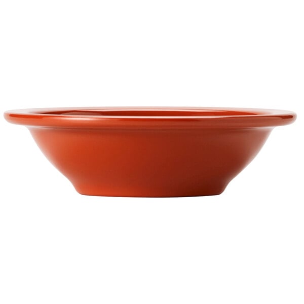 A close up of a red Libbey Cantina melamine fruit bowl.