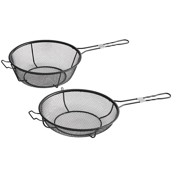 An Outset black wire grill basket and skillet with a black handle.